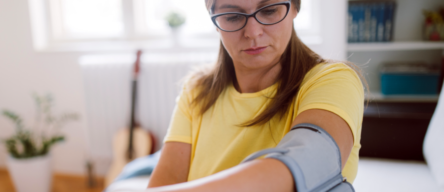 woman checking her blood pressure